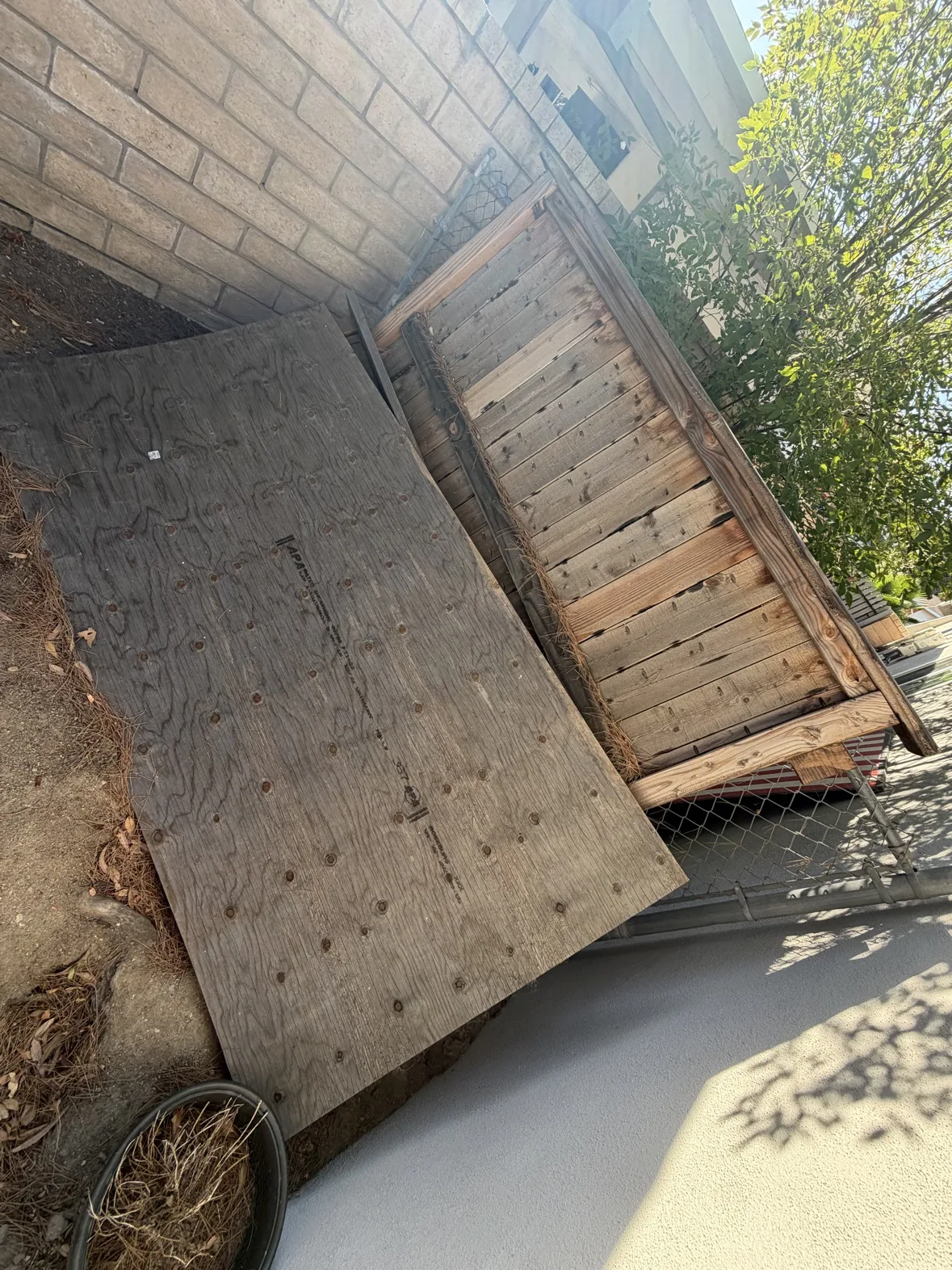Wood panels stacked for backyard junk removal